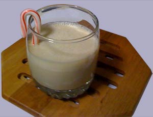 Christmas Blizzard cocktail with a candy-cane