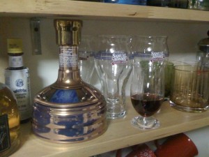 Samuel Adams Utopias bottle and snifter with a few ounces of Utopias poured in