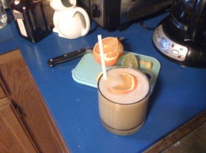 A large rocks glass containing a frozen Caribbean, a drink made with bananas, rum, and Cointreau.