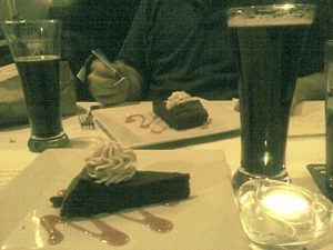 4thcourseadj Two glasses of Black Duck Porter and two flour-less chocolate cakes