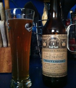 A pint of Full Sail Big Daddy J’s Malt Liquor next to a bottle of the same.