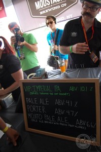 Matthew Spitz Co-owner and Brewer for Moustache Brewing manning the taps at the 2013 North Fork Craft Beer BBQ & Wine Festival