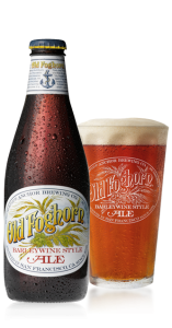 A bottle of Anchor Brewing Old Foghorn, next to a filled pint glass.