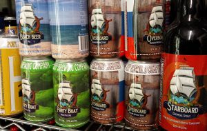 Cans of Port Jeff Brewing Party Boat Session IPA, Beach Beer, and Overboard
