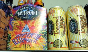 Two cans of Blue Point Brewing Toasted Lager