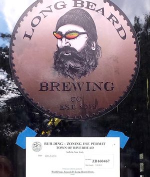 Long Beard Building Permit sign on door