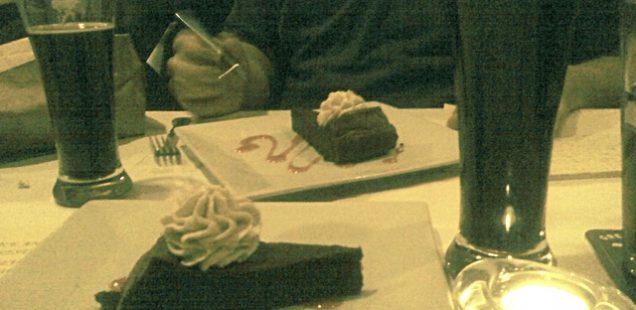 Two glasses of Black Duck Porter and two flour-less chocolate cakes