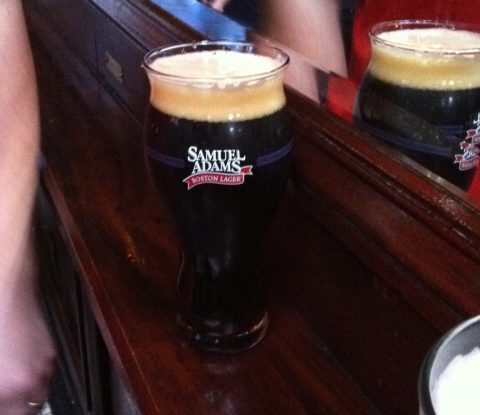 A pint of Samuel Adams Cherry Chocolate Bock in a specialty Samuel Adams glass