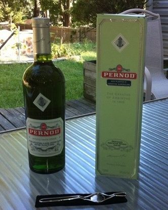 A bottle of Pernod Aux Plantes d’Absinthe Supérieure, the collector's box it came in, and a special sugar spoon with black velvet case