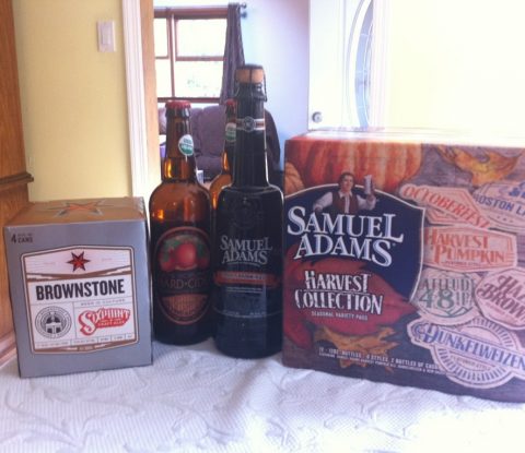 A pack of Sixpoint Brownstone, 2 bottles of Orchard Gate Gold JK's Scrumpy Hard Cider, a bottle of Samuel Adams Stony Brook Red, and a case of Samuel Adams Harvest Collection 2012