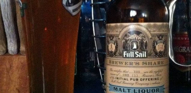 A pint of Full Sail Big Daddy J’s Malt Liquor next to a bottle of the same.