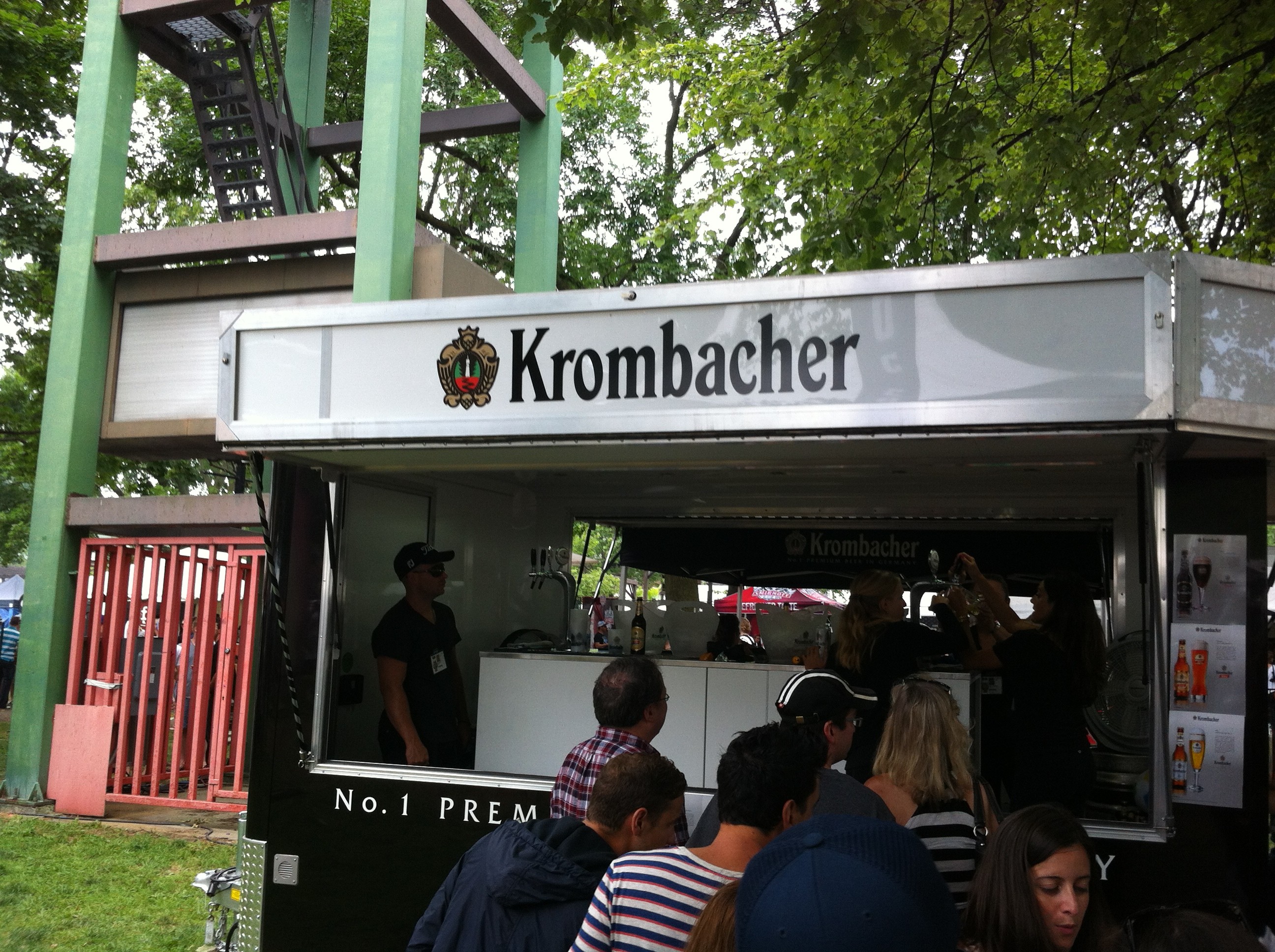 People line up to taste Krombacher beer served from a modified food trailer at Toronto’s Festival of Beer.