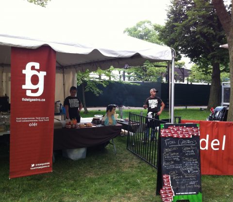 Signs and workers at the Fidel Gastro food tent at Toronto’s Festival of Beer