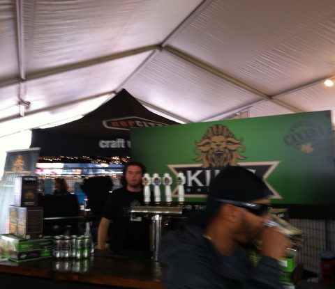 A young man waits to pour some samples of King Brewery beer at Toronto’s Festival of Beer