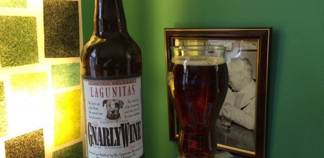 A bottle of Lagunitas GnarleyWine with a glass filled with the dark caramel-colored beer.