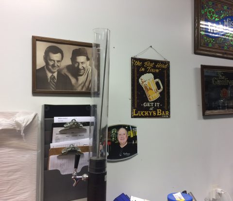 Pictures of the Odd Couple (Tony Randal and Jack Klugman), Ed Hahne, and old advertising signs from Lucky’s Bar, the Glenlivet, and Irish Mist at Long Ireland Brewery