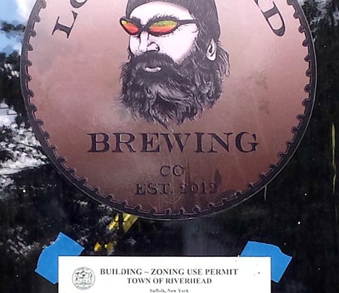 Long Beard Building Permit sign on door