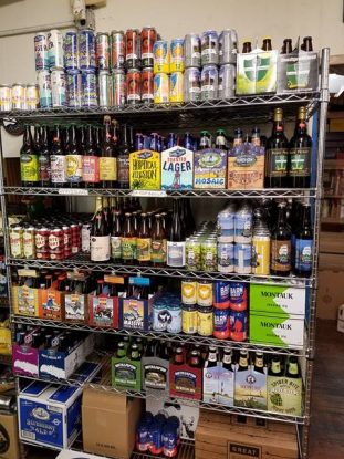 Six racks of cans and bottles of Long Island local beer at Bellport Cold Beer and Soda, in Bellport NY