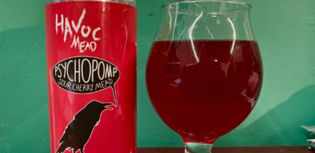 A can of Havoc Mead Psychopomp and a flared tulip glass partially filled with mead